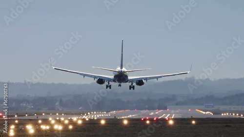 Commercial Airplane Landing in the morning