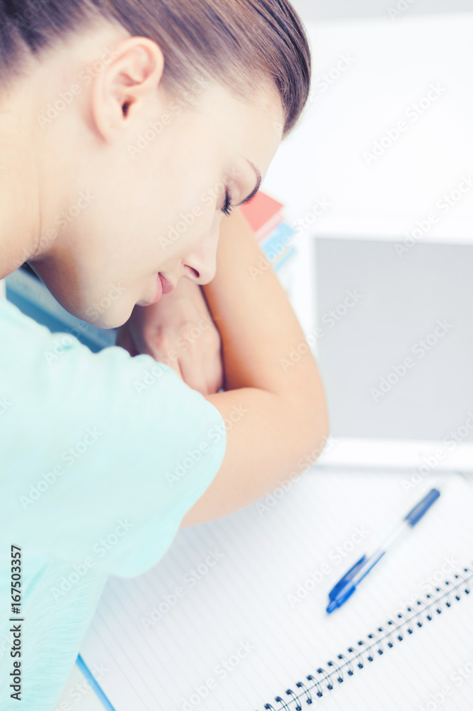 tired student sleeping on stock of books tired student sleeping on stock of books