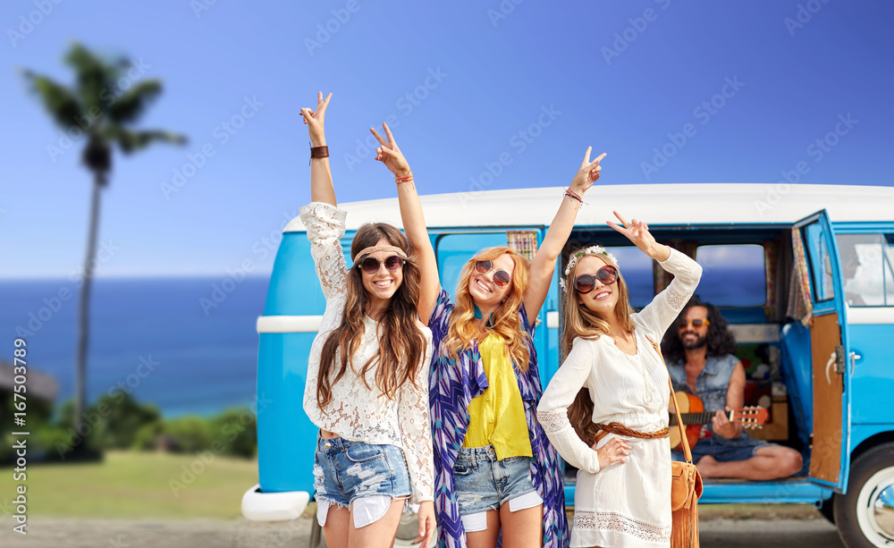 happy hippie friends at minivan car on beach happy hippie friends at minivan car on beach