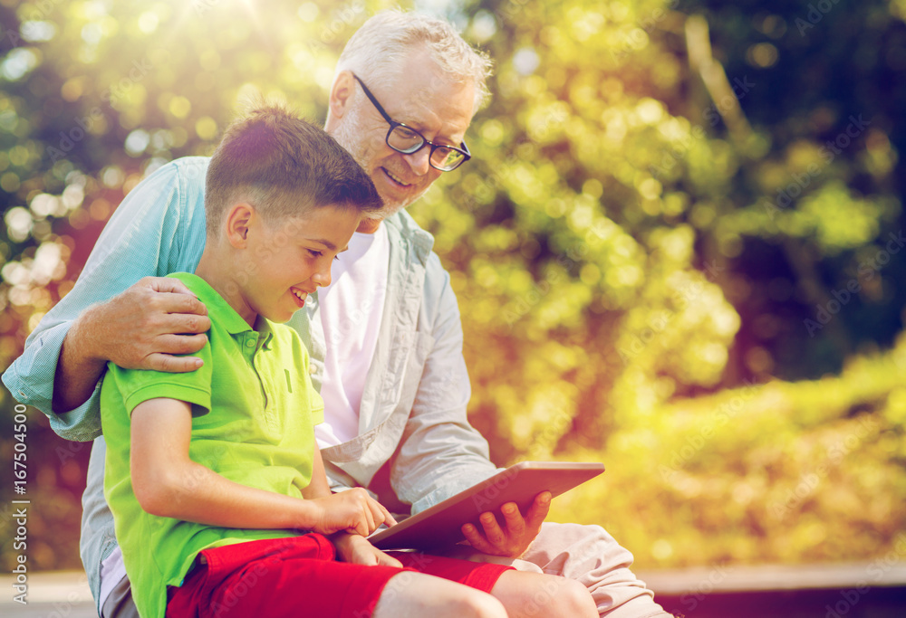 happy grandfather and boy with tablet pc outdoors happy grandfather and boy with tablet pc outdoors