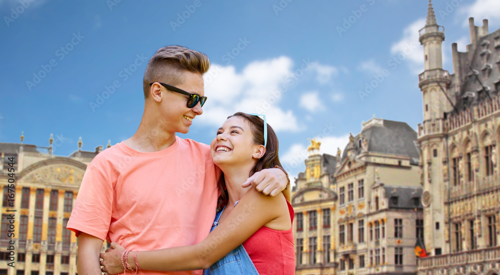 happy teenage couple hugging in brussels city