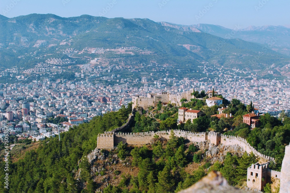 View of Alanya Castle and the city from the highest point of the terrain (Alanya, Turkey).