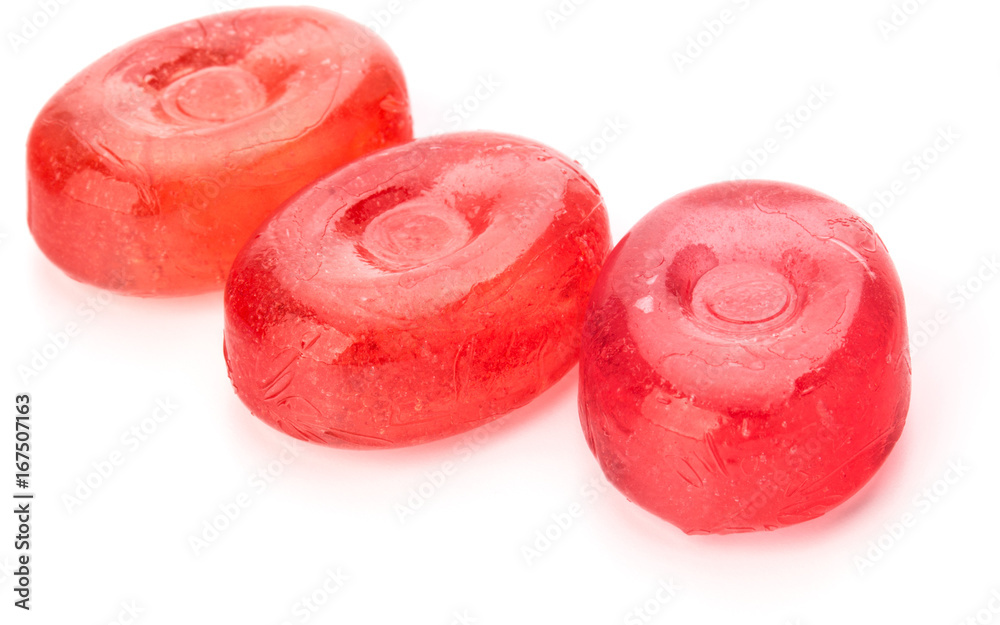 Three colorful fruit hard sugar candies, boiled sweeties or sugar plums isolated on white background cutout Three colorful fruit hard sugar candies, boiled sweeties or sugar plums isolated on white background cutout