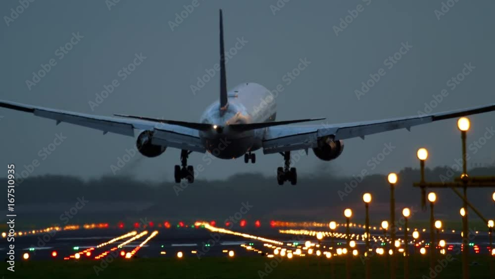 Airplane landing at the early morning Airplane landing at the early morning