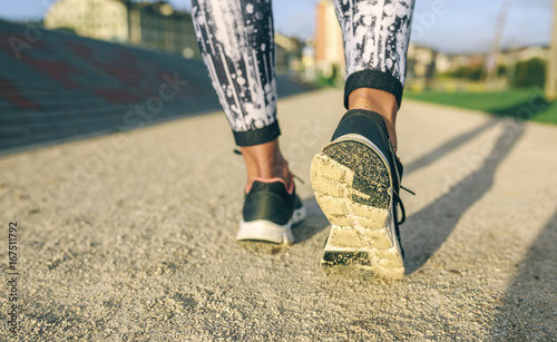 Low section of woman jogging at park