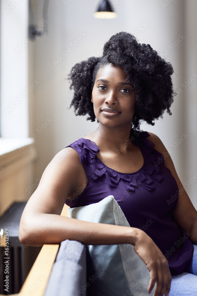 Portrait of confident businesswoman sitting in office Portrait of confident businesswoman sitting in office