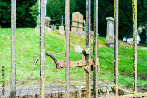 Iron gate at the entrance of a graveyard.