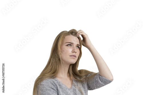 Blonde woman scratching head, isolated