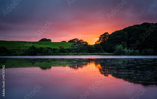 Vibrant sunset over lake