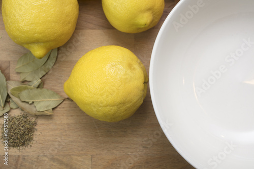 Person cutting and processing preserved salted lemons