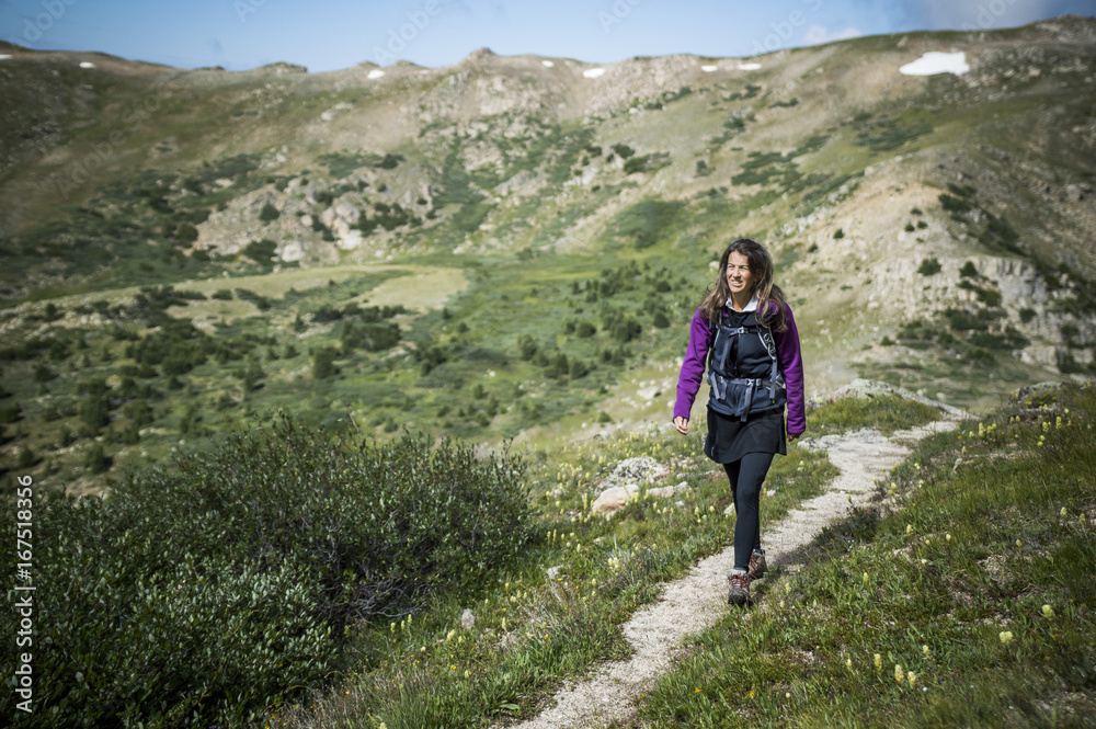 Woman Walking in Rocky Mountains
