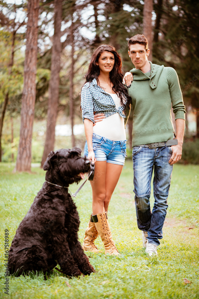 Smiling Couple With A Dog Smiling Couple With A Dog