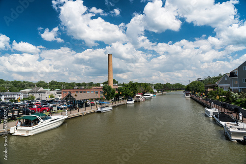 Erie canal with boats and buildings on a summer day in Fairport, New York