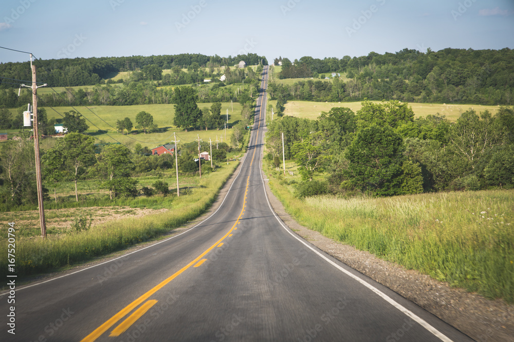 Empty rural road in the hilly countryside of upstate New York