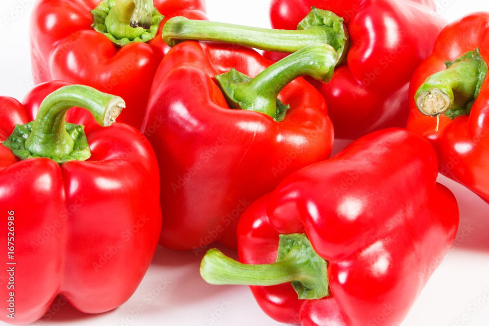 Heap of red ripe peppers on white background, healthy nutrition