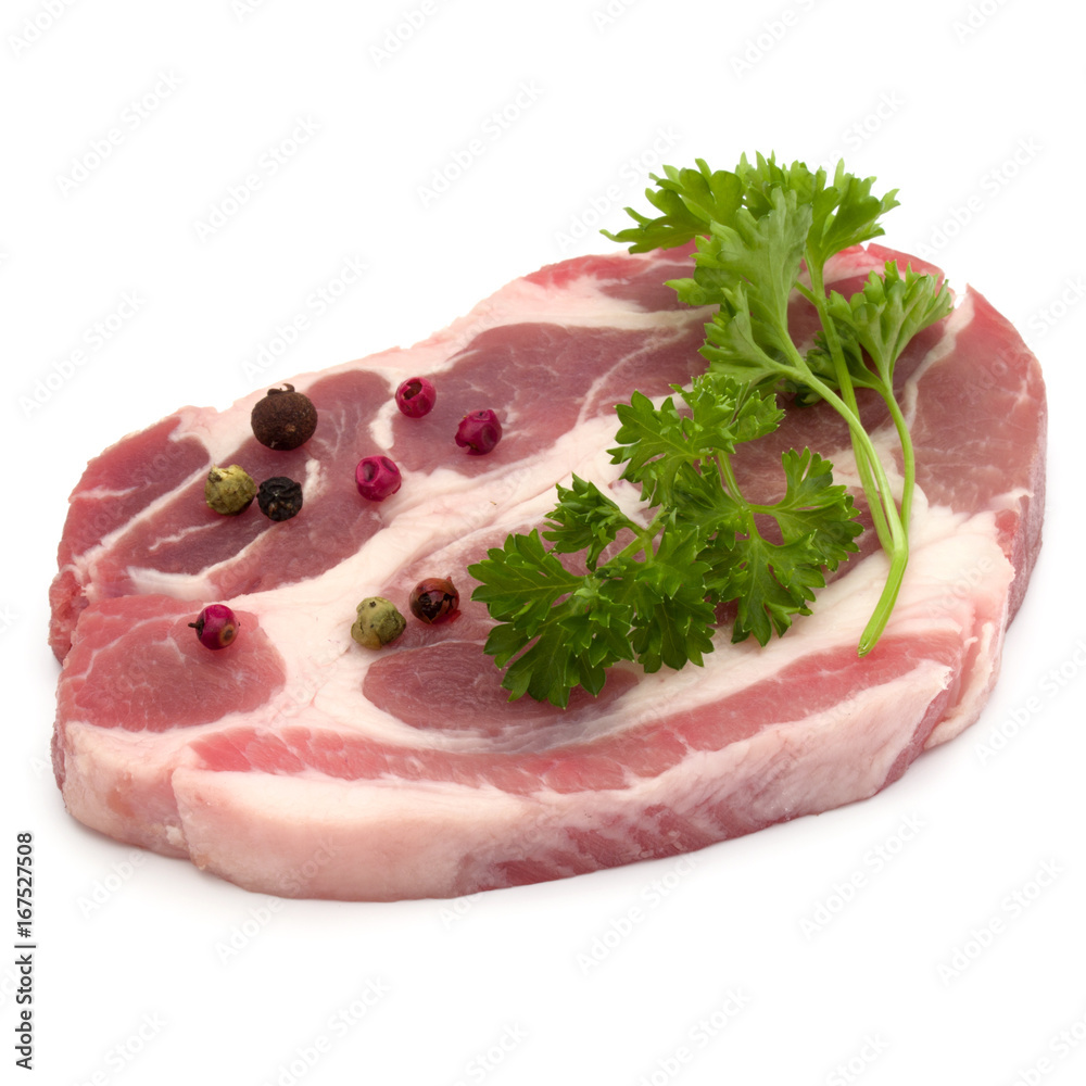 Raw pork neck chop meat with parsley herb leaves and peppercorn spices garnish isolated on white background cutout