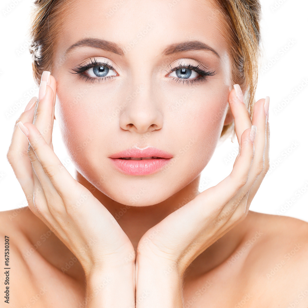 Young woman touching her face isolated on white background