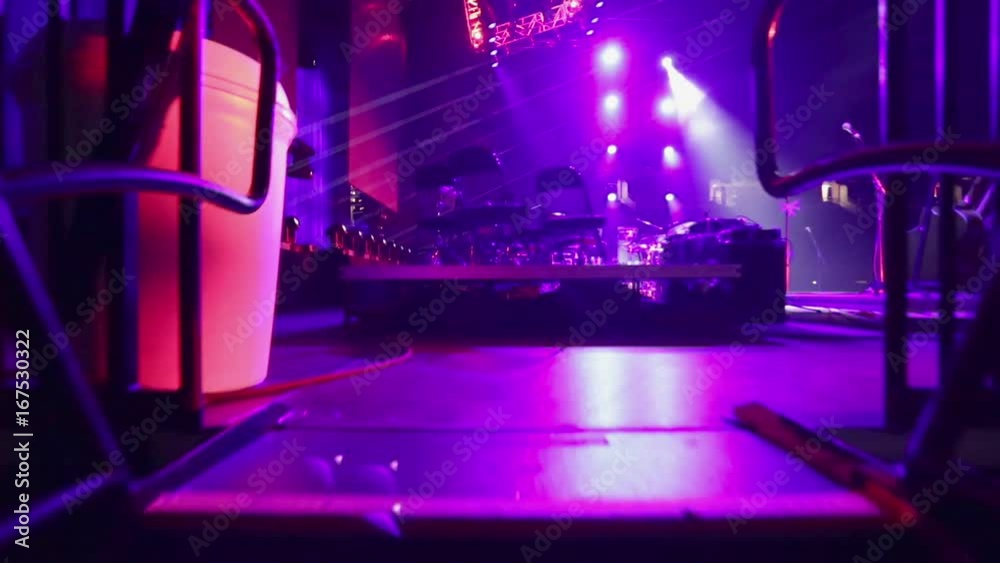 POV of musician entering a stage through stairs for sound check before concert