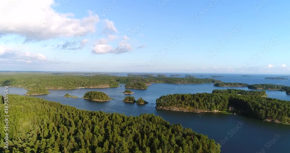 Finnish islands, Cinema 4k aerial view flying over islands, in uusimaa saaristo archipelago, on the gulf of finland, on a sunny evening dawn, in the Baltic sea, in Raasepori, Finland