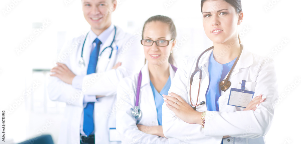 Portrait of a smiling medical team standing with their hands crossed. Portrait of a smiling medical team standing with their hands crossed.