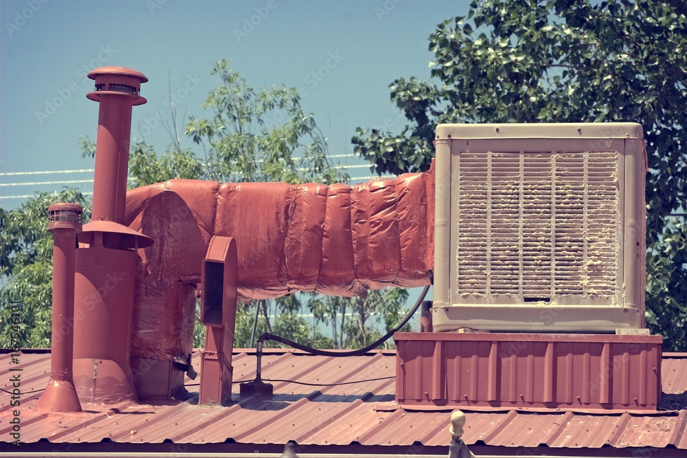 Old swamp cooler or evaporative cooler to show how bad the old units are  with calcium build-up compared to new A/C. This is located in New Mexico,  US. Stock Photo | Adobe