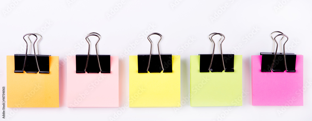 self-stick notes and binder clips on a white background
self-stick notes and binder clips on a white background