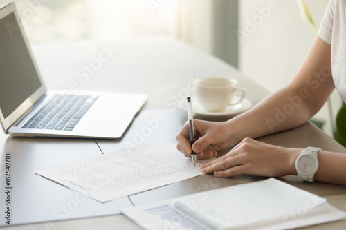 Quadro em tela Businesswoman signing paper at workplace, company executive putting signature on