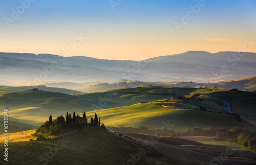 The rolling hills and green fields at sunrise, Tuscany, Italy