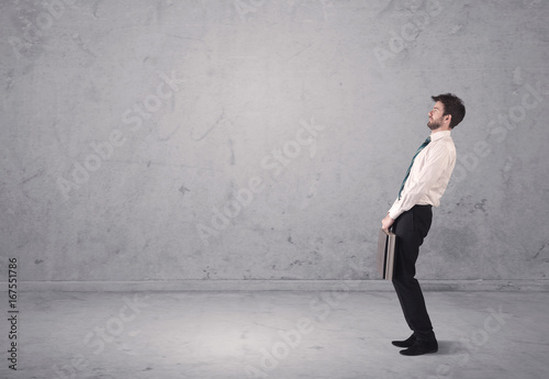 Young businessman standing confused © ra2 studio