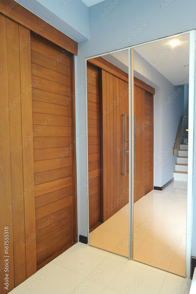 Fototapeta premium modern apartment with wood door and the staircase