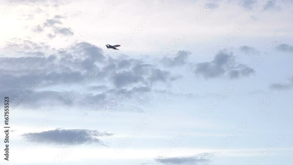 Deluxe class travel. Business jet flies in the sky with clouds Deluxe class travel. Business jet flies in the sky with clouds