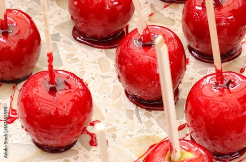 red apple covered with caramelized sugar photo