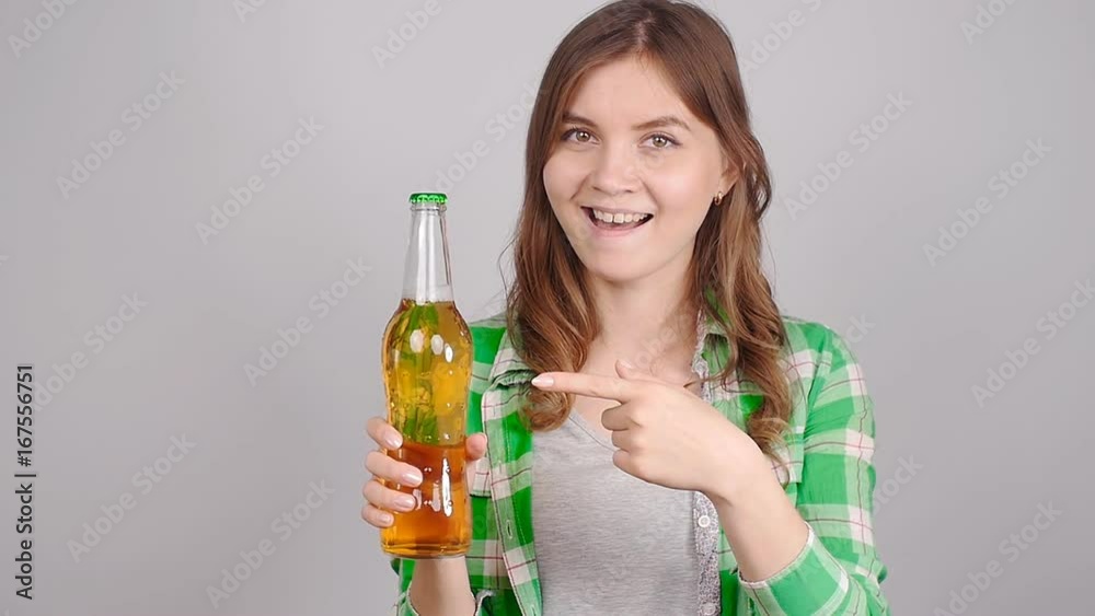 Young woman with bottle of beer Young woman with bottle of beer