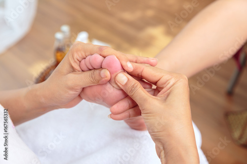 Foot massage in spa salon,Thai massage.