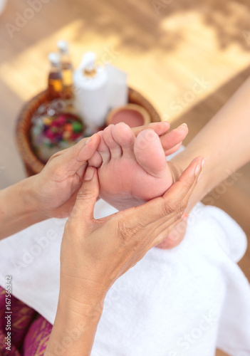 Foot massage in spa salon,Thai massage.