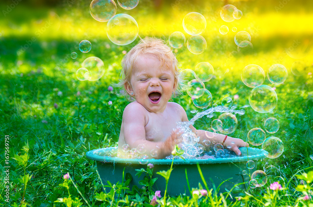 Cute baby toddler girl having fun with water. Cute baby toddler girl having fun with water.