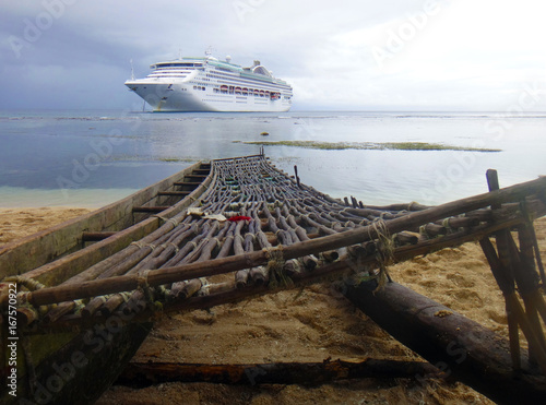 Cruise ship from the beach of Kiriwina Island, Papua New Guinea. photo