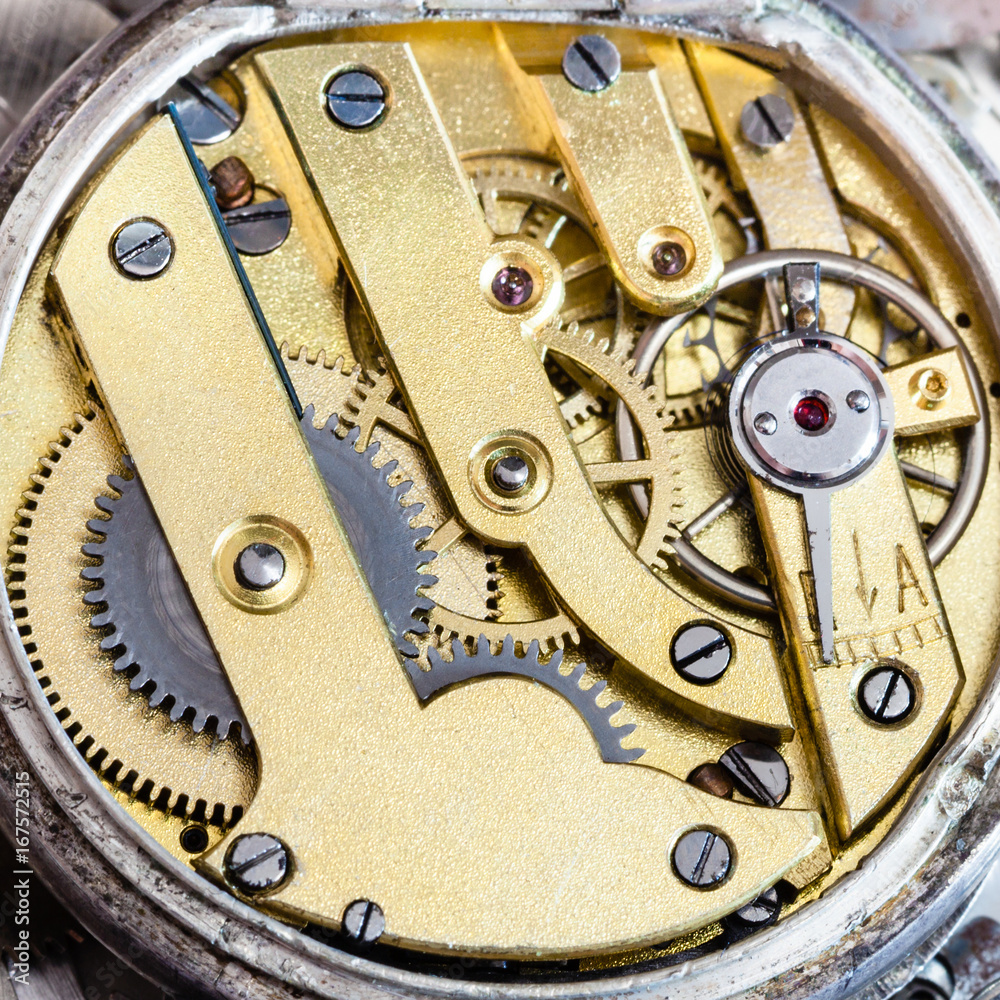 brass clockwork of old mechanical pocket watch