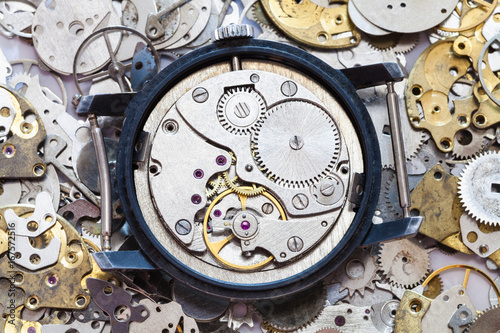 used mechanical wristwatch on heap of spare parts