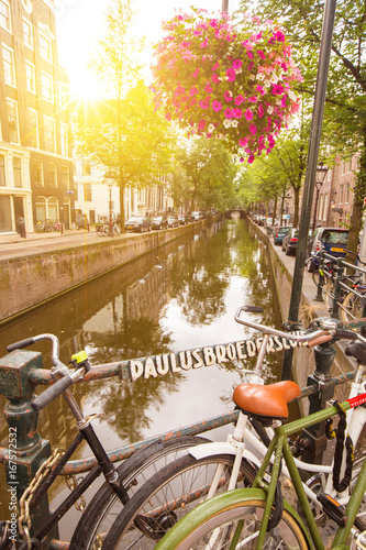 Photography An old bike near a canal in a street of Amsterdam, Netherlands