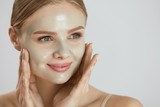 Cosmetic Mask. Beautiful  Smiling Woman Applying Mask On Face