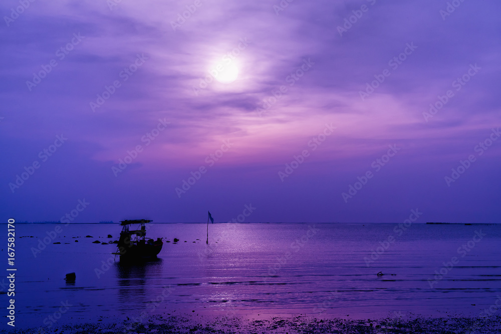 Twilight with purple sky at the sea beach