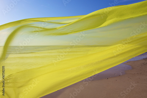 yellow tissue flying over the sea