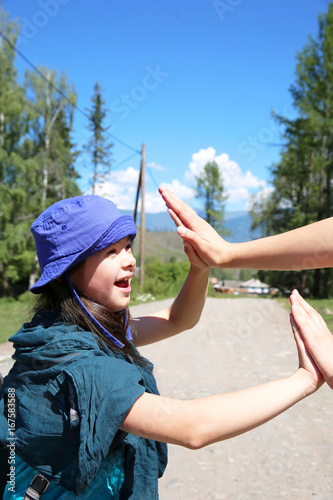 Little girl have fun in the mountine photo