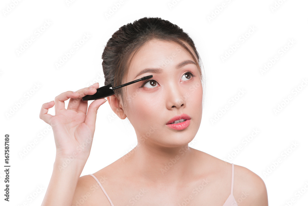 Portrait of a girl with a make-up brush for lash in hands isolated on white Portrait of a girl with a make-up brush for lash in hands isolated on white