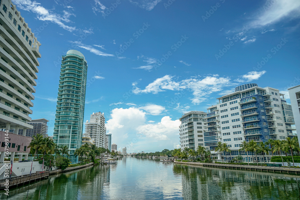 Miami beach. View of the city from the bridge. Beautiful houses separated by a river