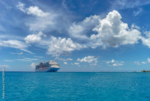 Cruise ship in crystal blue water and beautiful clouds © Hladchenko Viktor