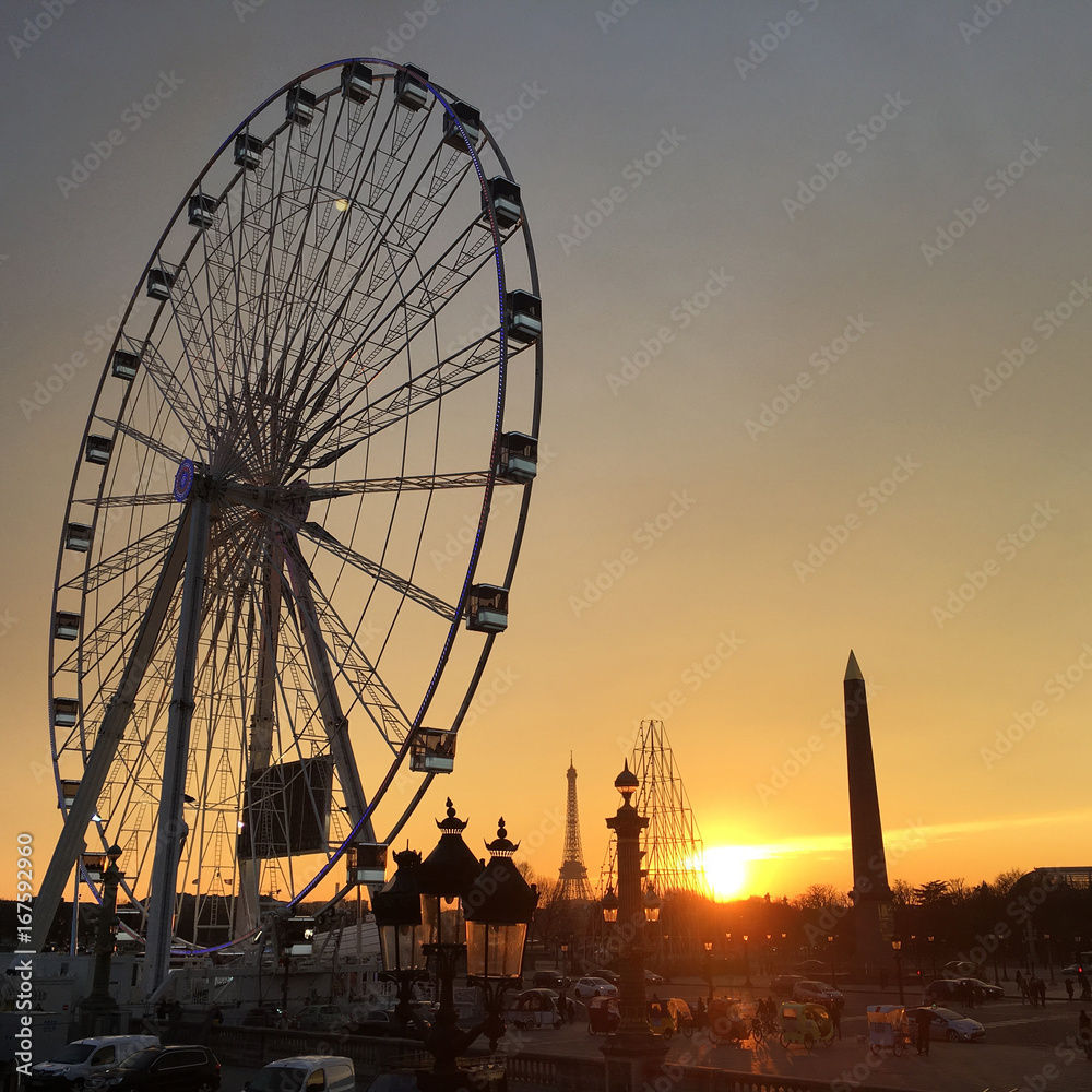 The big wheel on Paris at sunset, and famous monuments shadows