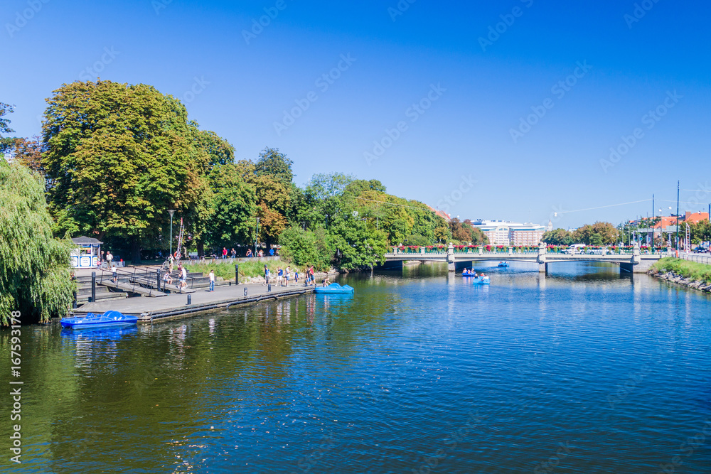 MALMO, SWEDEN - AUGUST 27, 2016: People enjoy a sunny day at Rorsjo canal in Malmo, Sweden.