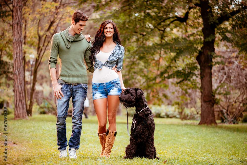 Smiling Couple With A Dog Smiling Couple With A Dog